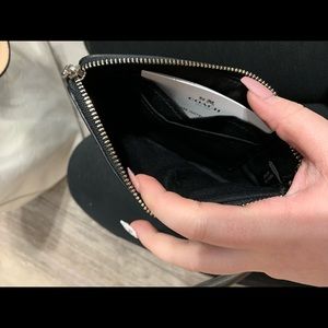 Metallic coach wristlet